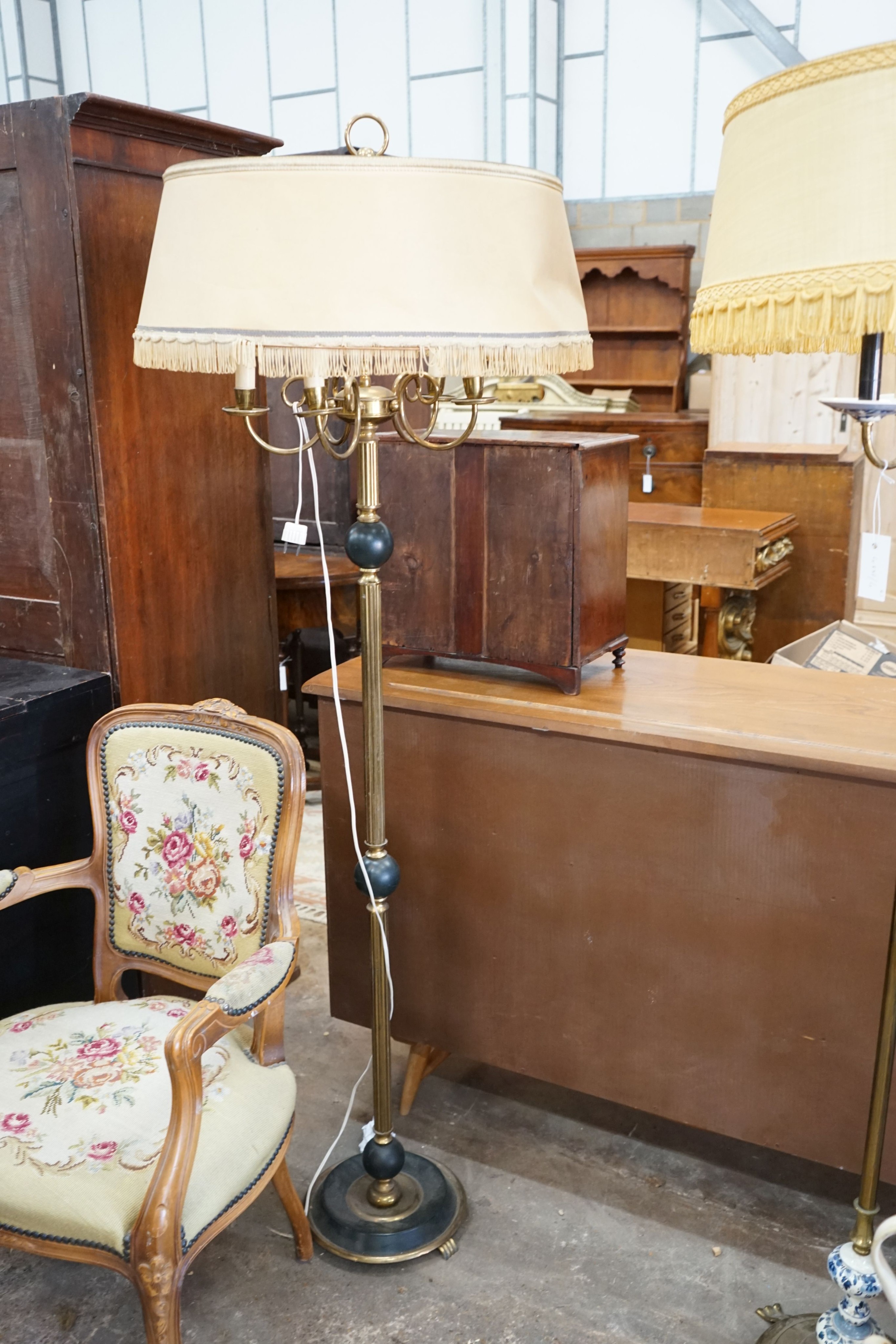 Two brass standard lamps, larger including shade height 165cm